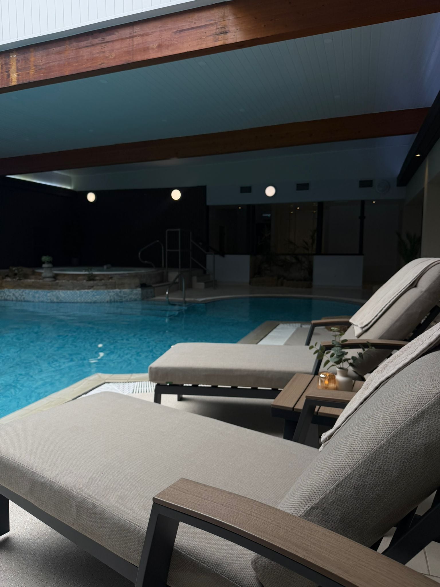 Loungers beside the pool at the Hideaway
